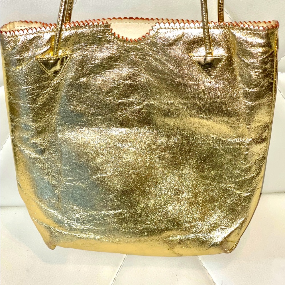Carlos Falchi gold leather clubbing bag